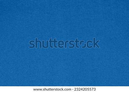 Dark Blue denim fabric texture background, the strong cotton cloth used especially to make jeans. A fabric sample isolated over white background