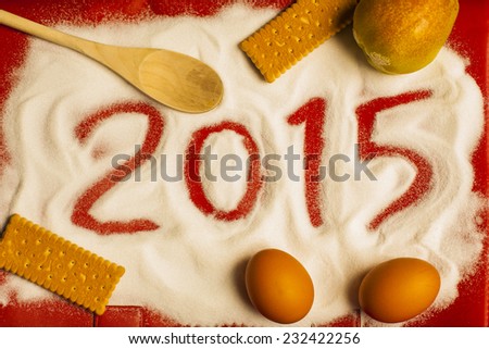 2015 sign draw in the sugar with food, eggs, cookies, biscuits, culinary, art, photo in landscape format perfect for a food blog 