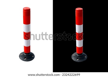 A traffic cone separating the road on a white and black background