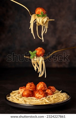 Food photography of meatball, chicken, beef; meat, spaghetti, pasta, tomato, sauce, basil, veal, fried, grilled, roasted, fork Royalty-Free Stock Photo #2324227861