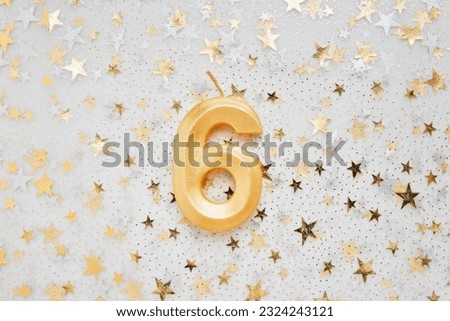 Number 6 six golden celebration birthday candle on on Festive Background. Six years birthday. concept of celebrating birthday, anniversary, important date, holiday Royalty-Free Stock Photo #2324243121