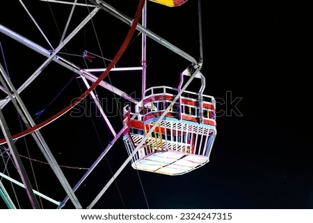 Glowing Nighttime Delight: Ferris Wheel Wagon Illuminated