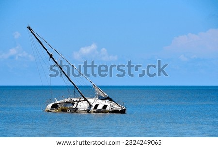 A sailboat runs aground and sinks in the shallow waters around Key West Royalty-Free Stock Photo #2324249065