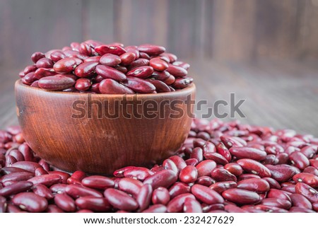 Red beans on wooden background - film effect style pictures