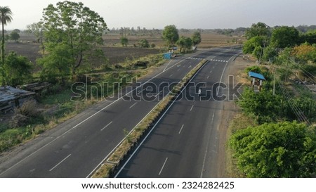 Aerial view of a highway passing through the rural areas in maharashtra, India