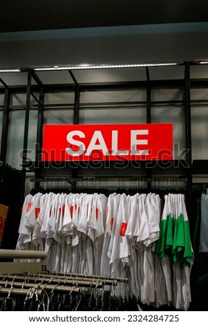 a "sale" sign at shopping center