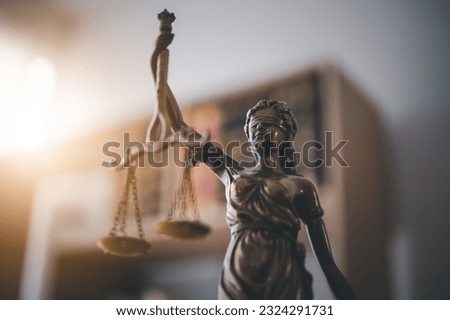Lady justice,Law theme, mallet of the judge, law enforcement officers, evidence-based cases and documents taken into account.	