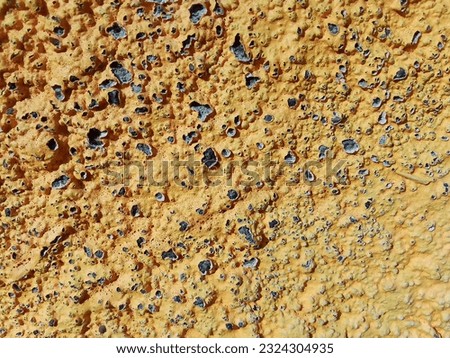 The close up of peeling paint on the wall. suitable for background.
