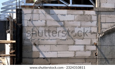 block of concrete walls that make up a strong building, stacked crosswise Royalty-Free Stock Photo #2324310811