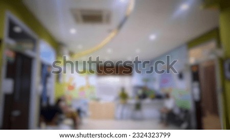 Defocused abstract background of nurse's room with several patients who are waiting for the doctor's queue. Blur view of hospital waiting room with nurse's table