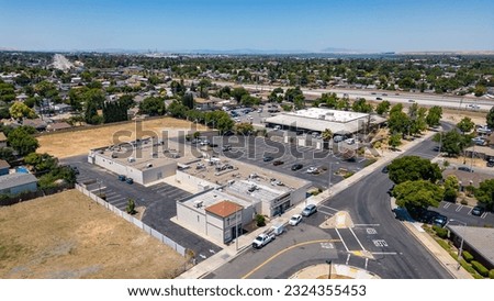 Antioch, California USA June 28, 2023: Aerial images over a commercial property with a vacant field