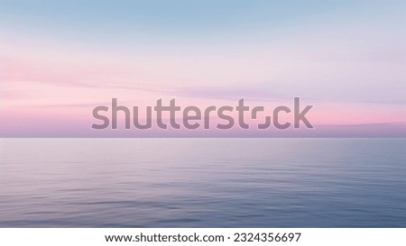 Clear blue sky sunset with glowing pink and purple horizon on calm ocean seascape background. Picturesque Royalty-Free Stock Photo #2324356697