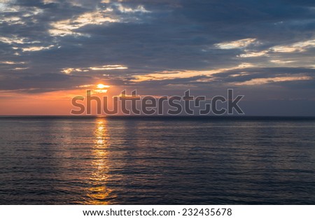 Seascape and cloudy sky before sunset