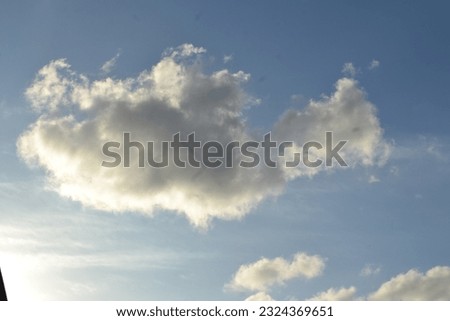 Floating clouds in the bright sunset
