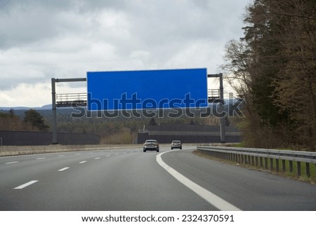 Highway Advertising. A Blank Mockup Billboard Towering Near the Motorway