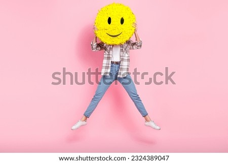 Full body size photo of jump overjoyed crazy blogger lady hiding her face happy smile emoji pinata icon isolated on pink color background