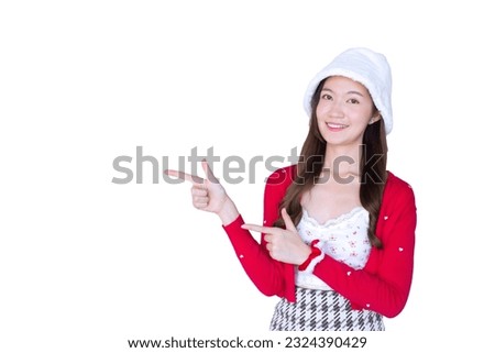 Beautiful Asian woman who wears red coat and white hat as Santy girl acts her hand to present something isolated on white background.