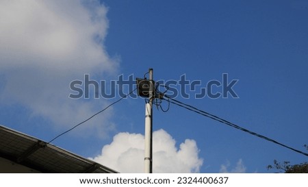 solar panels on a pole with a blue sky as a background. eco-friendly technology