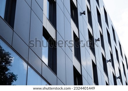 Close-up of Dark grey metallic panel facad. Modern architectural details.  Royalty-Free Stock Photo #2324401449