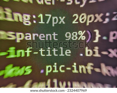 Binary computer code background, abstract. Coding css on mornitor at the office - for background or montage product. Young business crew working with startup