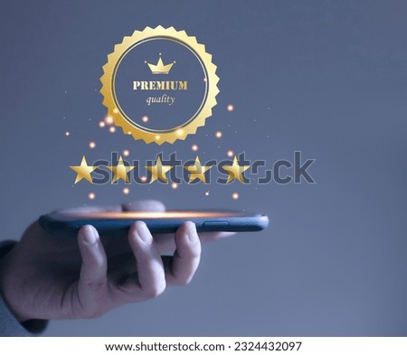 Businessman hand showing signs of best service, quality assurance through smartphone, warranty, standard, iso certification and standards concept. Product warranty and ISO service concept
