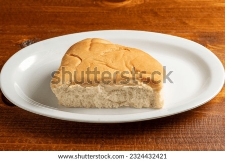 Piece of coco bread on a plate