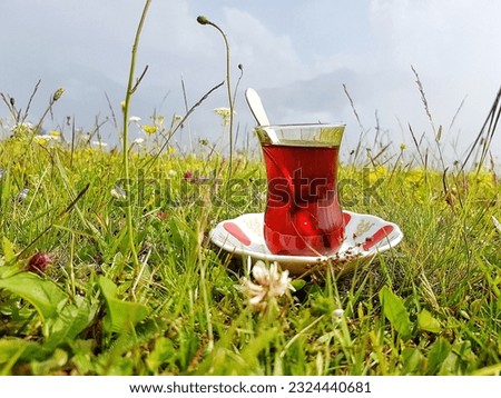 freshly prepared turkish tea in wildflowers