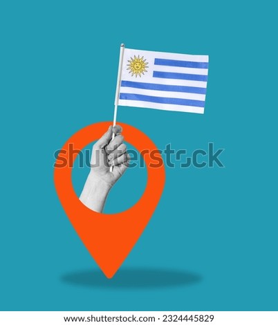 Art collage, hand with flag of Uruguay on blue background with navigation sign. Concept of navigation and placement.