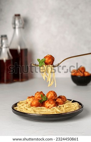 Food photography of meatball, chicken, beef; meat, spaghetti, pasta, tomato, sauce, basil, veal, fried, grilled, roasted, fork Royalty-Free Stock Photo #2324450861