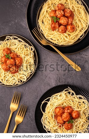 Food photography of meatball, chicken, beef; meat, spaghetti, pasta, tomato, sauce, oregano, fried, grilled, roasted, fork Royalty-Free Stock Photo #2324450977