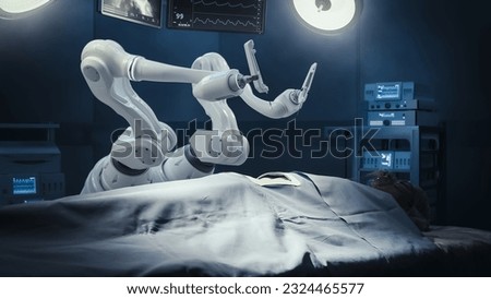 Modern Hospital: Surgery Patient Laying On Surgical Table While Robot Arms Performing High-Precision Nanosurgery. Automated And Programmable Robotic Limbs Working On Heart Transplant On Person. Royalty-Free Stock Photo #2324465577