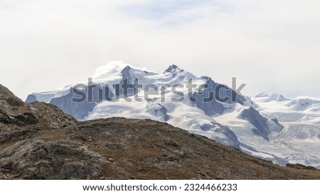 Panorama view with mountain summit Nordend (left) and Dufourspitze (right) in mountain massif Monte Rosa in Pennine Alps, Switzerland Royalty-Free Stock Photo #2324466233