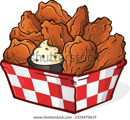 Big delicious basket of hot saucy buffalo chicken wings piled high with a creamy ranch dipping sauce image for sports bar signage or menus Royalty-Free Stock Photo #2324470619
