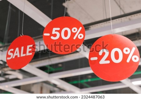 red circles hanging in the store with numbers and percentages of the discount, the concept of a sale or black friday