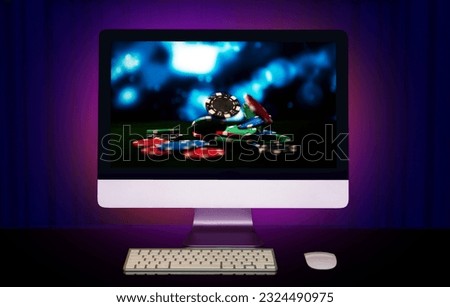 Online gambling. Poker online. Casino online. The computer is on a table with a picture of gambling.