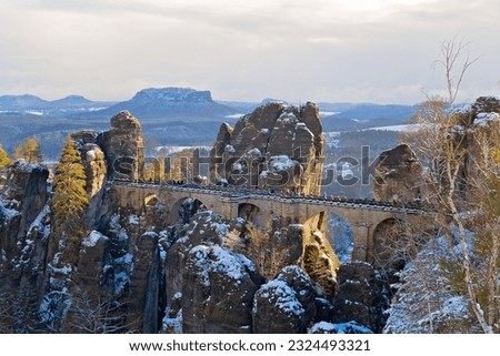 Bastei Bridge in Saxon Switzerland National Park during winter, Germany Royalty-Free Stock Photo #2324493321