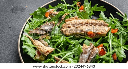 sardine salad green leaves salad mix healthy meal food snack on the table copy space food background rustic top view keto or paleo diet vegetarian pescatarian diet Royalty-Free Stock Photo #2324496843