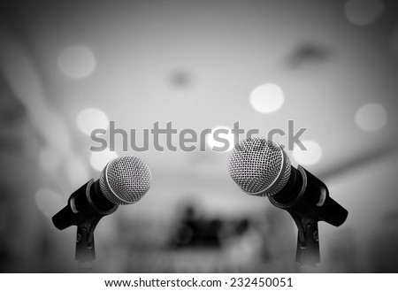 Microphone isolated on grey room Royalty-Free Stock Photo #232450051