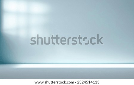 Minimal abstract light blue background for product presentation. Shadow and light from windows on plaster wall. Royalty-Free Stock Photo #2324514113