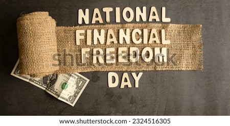 National Financial Freedom Day, Jute roll on dark background and a currency note Selective focus Royalty-Free Stock Photo #2324516305