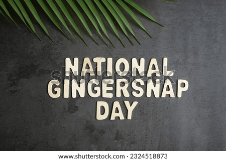 International Gingersnap day, a green leaf on grey background Selective focus