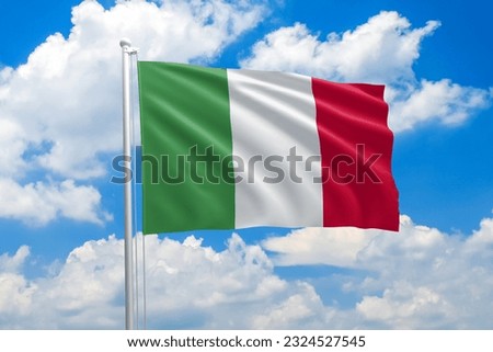 Italy national flag waving in the wind on clouds sky. High quality fabric. International relations concept