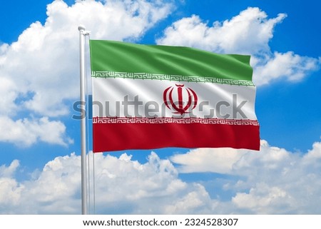 Iran national flag waving in the wind on clouds sky. High quality fabric. International relations concept