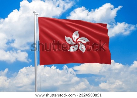 Hong Kong national flag waving in the wind on clouds sky. High quality fabric. International relations concept