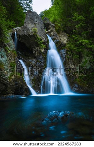 Bash Bish Waterfalls in Mt Washington at the border of Massachusetts and New York. Tranquil long exposure nature hiking landscape.