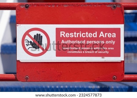 Red and white restricted area sign, authorized persons only, with hand icon, on the deck of a ferry Royalty-Free Stock Photo #2324577873
