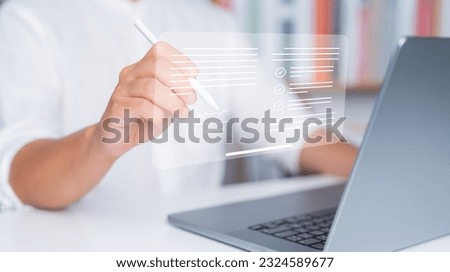 Electronic signature and paperless for office concept. Businessman uses a pen to sign an electronic documents in a digital documents on virtual screen. E-signing, Smart document technology management.