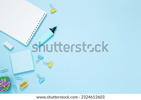 Mockup notebooks and set of stationery for work and study on blue background. Back to school. Top view, flat lay, copy space
