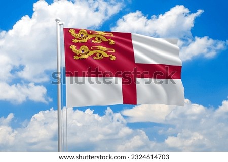 Sark national flag waving in the wind on clouds sky. High quality fabric. International relations concept
