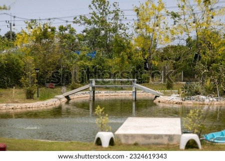 Small river, bridge and green field in garden which is peaceful and romantic. Synchronize between nature and the town. Wonderful scenery.